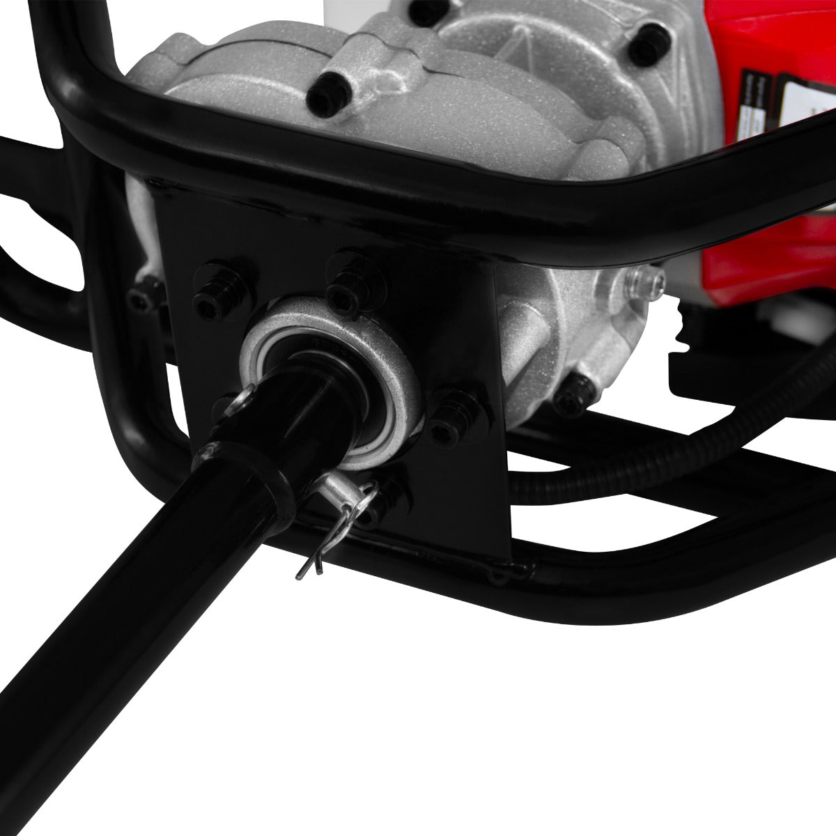 Dettaglio della trivella a benzina T-Mech 52cc, evidenziando il motore argentato e il telaio nero robusto con tubi e raccordi