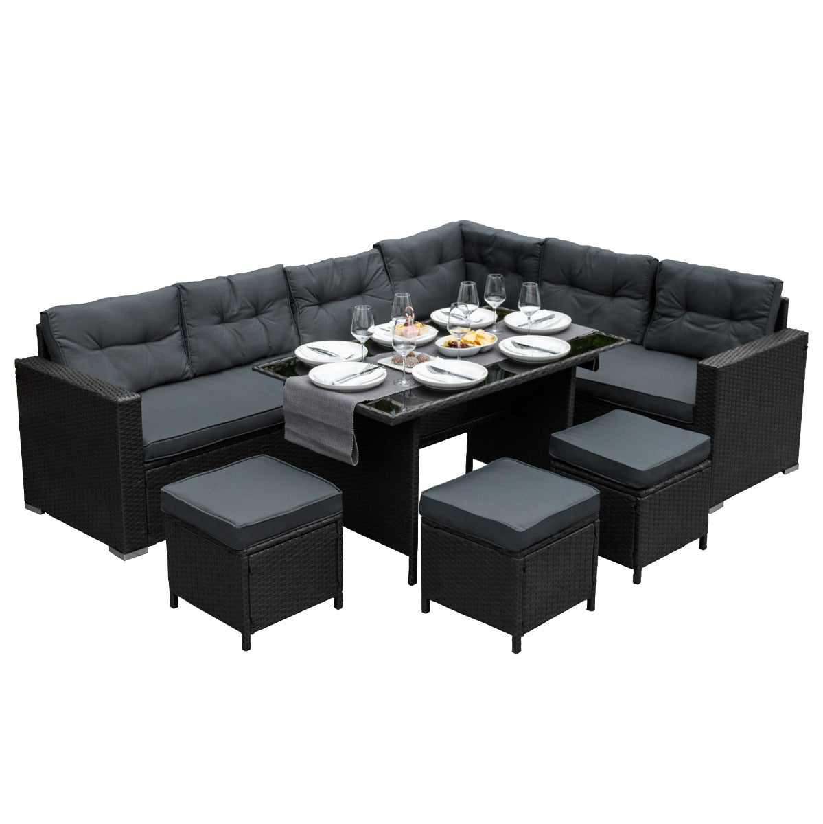 Set ad angolo in rattan nero con cuscini grigi, tavolo in vetro, ideale per esterni, elegante e funzionale per pranzi all'aperto
