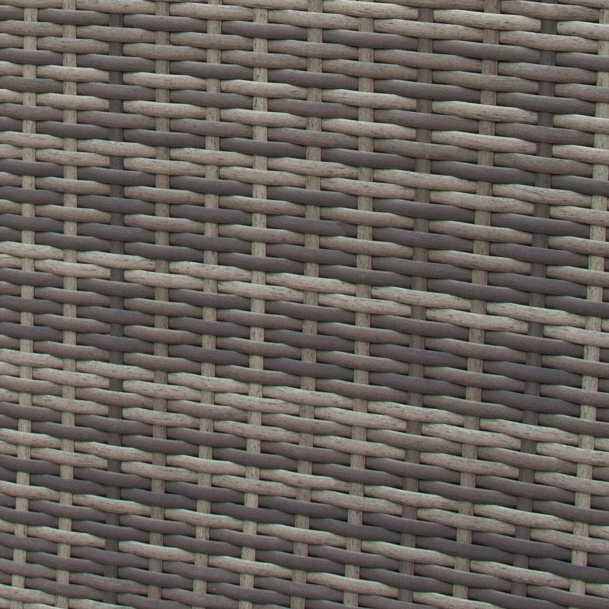 Set ad angolo in rattan grigio, con trama intrecciata e texture morbida, perfetto per arredare spazi esterni con eleganza