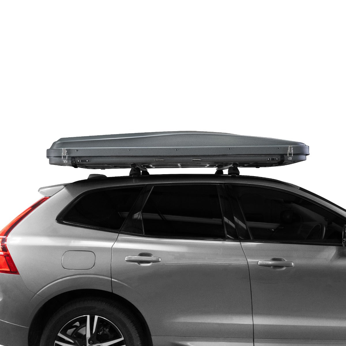 Tenda da tetto grigia per auto, design aerodinamico, superficie liscia e lucida, montata su un veicolo grigio con barre portatutto