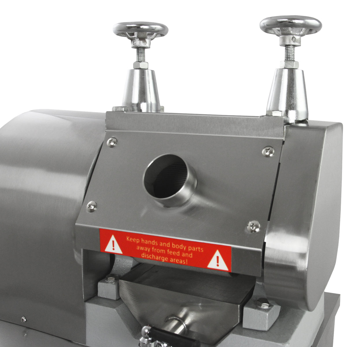 Macchina per alimenti in acciaio inox con manopole cromate, fessura di alimentazione e avvisi di sicurezza evidenti in rosso