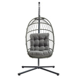 Poltrona sospesa a uovo in rattan grigio con cuscino imbottito, struttura nera, design moderno e accogliente per interni ed esterni