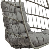 Poltrona sospesa a uovo in rattan grigio con cuscino imbottito, struttura intrecciata e design moderno per interni ed esterni
