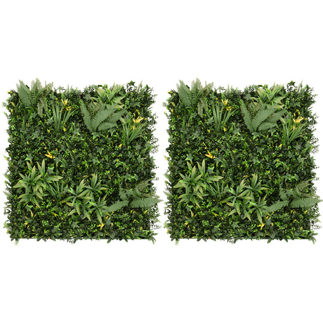 Parete verde artificiale con foglie di diverse tonalità di verde, piante tropicali e texture naturali, ideale per decorazioni interne