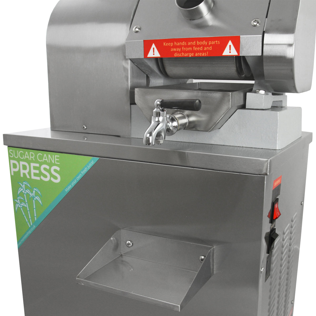 Pressa per canna da zucchero in acciaio inox, con maniglia cromata e avviso di sicurezza, design moderno e funzionale