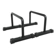 Parallettes in acciaio nero, con tubi robusti e maniglie antiscivolo, ideali per allenamenti di forza e calisthenics