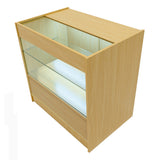Bancone negozio in legno d'acero con illuminazione LED, ripiani in vetro trasparente e cassetto inferiore in legno chiaro