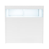 Bancone negozio bianco con illuminazione LED blu, design moderno e linee pulite, ideale per esposizione e vendita prodotti