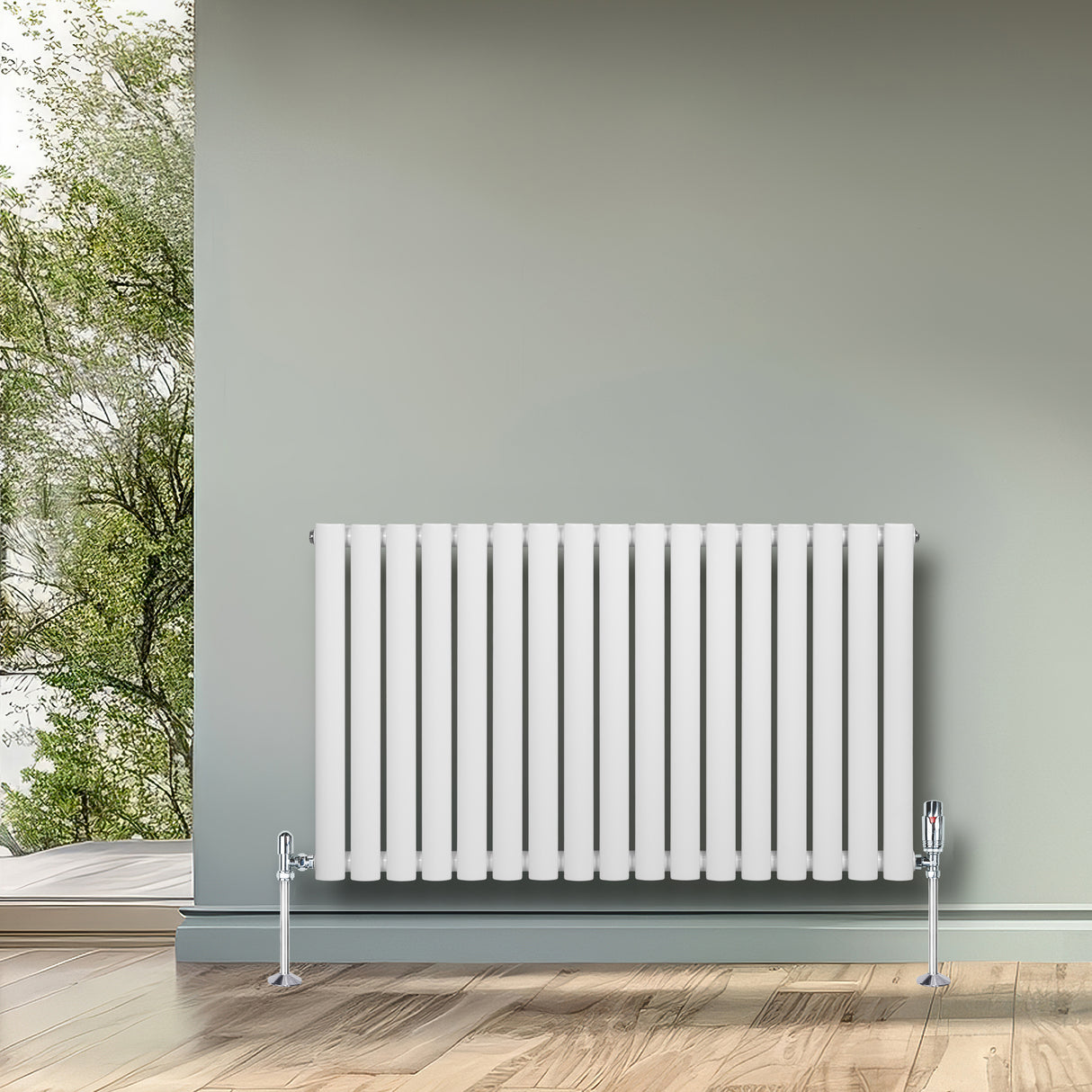 Radiatore ovale a colonna singola orizzontale bianco, con finitura liscia e valvole, posizionato su un pavimento in legno chiaro