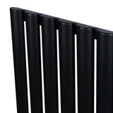 Radiatore ovale a colonna singola orizzontale, finitura nera opaca, con sei tubi verticali e valvole integrate, design elegante e moderno