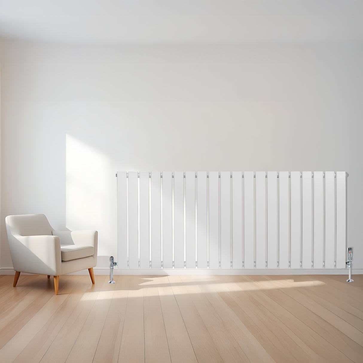 Radiatore piatto monocolonna bianco, 600 x 1400 mm, con valvole, posizionato su parete bianca accanto a una poltrona moderna