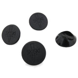 Set di 4 piedini protettivi neri per gambe hairpin, realizzati in gomma, con superficie liscia e logo inciso per una finitura elegante