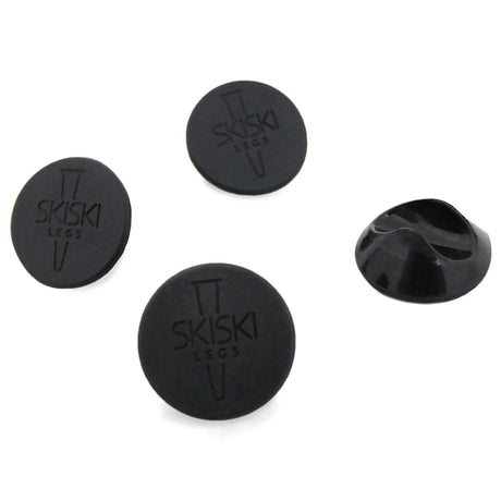 Set di 4 piedini protettivi neri per gambe hairpin, realizzati in gomma, con superficie liscia e logo inciso per una finitura elegante
